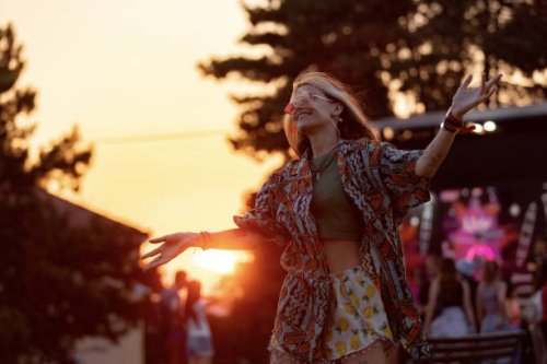 happy hipster woman enjoying on an outdoor music festival at sunset. - concert stock pictures, royalty-free photos & images
