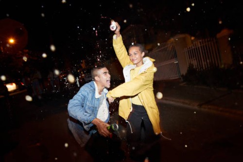 happy man and woman splashing drink - fashion stock pictures, royalty-free photos & images