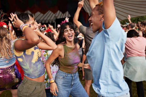 happy man and women dancing at concert - concert stock pictures, royalty-free photos & images