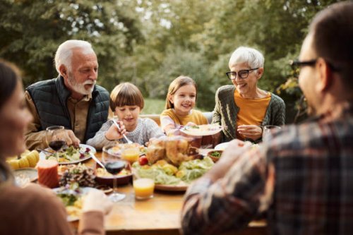 happy multi-generation family having lunch in nature. - food stock pictures, royalty-free photos & images