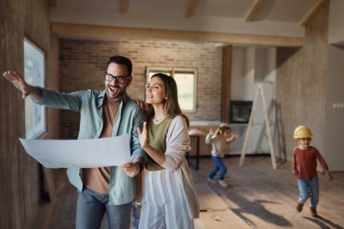 happy parents making plans in their new home. - home decoration stock pictures, royalty-free photos & images