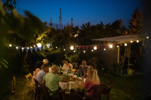 happy senior friends on birthday party at backyard - garden decoration stock pictures, royalty-free photos & images