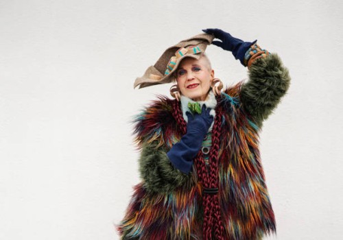 happy senior woman wearing colorful fur posing over white background, new york city - fashion stock pictures, royalty-free photos & images