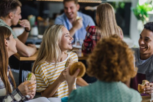 happy students talking while having lunch break at cafeteria. - food stock pictures, royalty-free photos & images