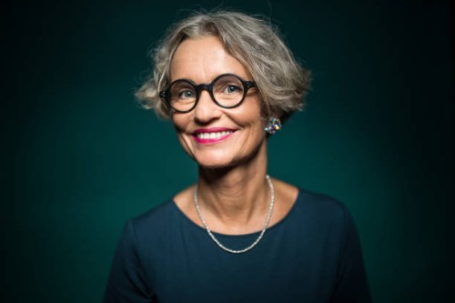happy woman in eyeglasses against green background - fashion stock pictures, royalty-free photos & images