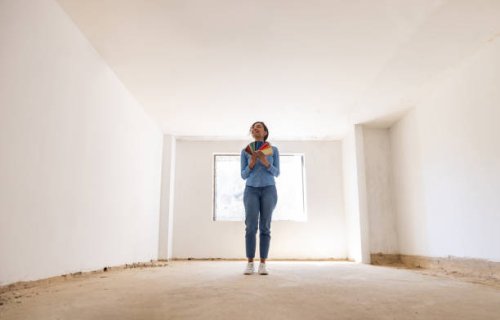 happy woman remodeling her house and choosing a color for the walls - home decoration stock pictures, royalty-free photos & images