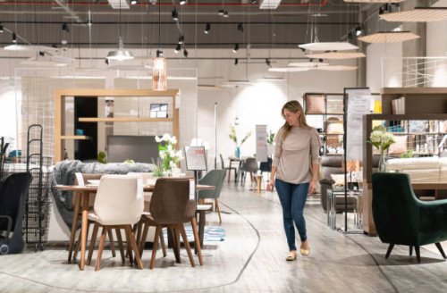 happy woman shopping at a furniture store - home decoration stock pictures, royalty-free photos & images