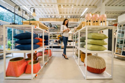happy woman shopping at a home decor store - home decoration stock pictures, royalty-free photos & images