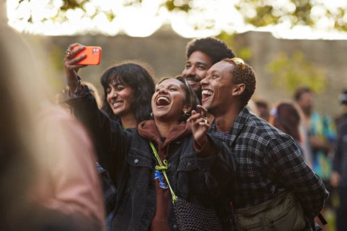 happy woman taking selfie with friends through smart phone - concert stock pictures, royalty-free photos & images
