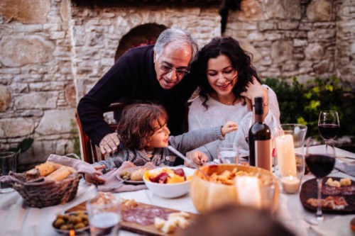 happy young grandson having lunch at grandparents rustic house - food stock pictures, royalty-free photos & images