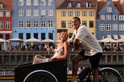 happy young man with girlfriend in cargo bike - travel stock pictures, royalty-free photos & images