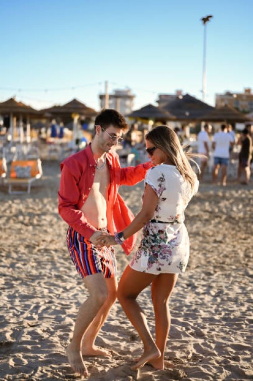 happy young people dancing at the beach - concert stock pictures, royalty-free photos & images