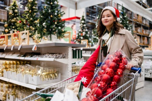 happy young woman doing shopping at christmas market - home decoration stock pictures, royalty-free photos & images