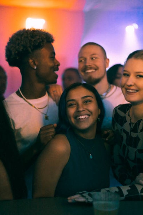 happy young women and men dancing in club on weekend at night - concert stock pictures, royalty-free photos & images