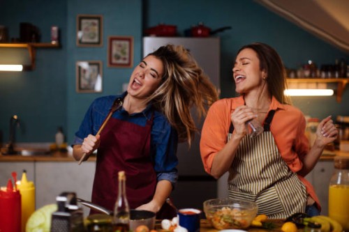 having a singing showdown while cooking dinner - food stock pictures, royalty-free photos & images