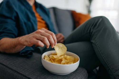 having snack - junk food stock pictures, royalty-free photos & images