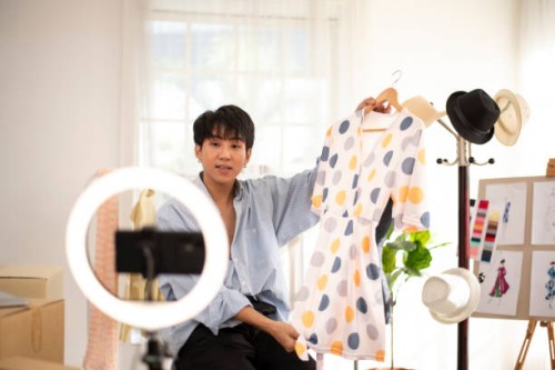 he is going live to sell clothes he sews himself online. - fashion stock pictures, royalty-free photos & images