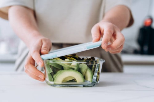 healthy lunch at the lunch box zucchini pancakes and avocado salad , healthy lunch to go for school and college students - junk food stock pictures, royalty-free photos & images