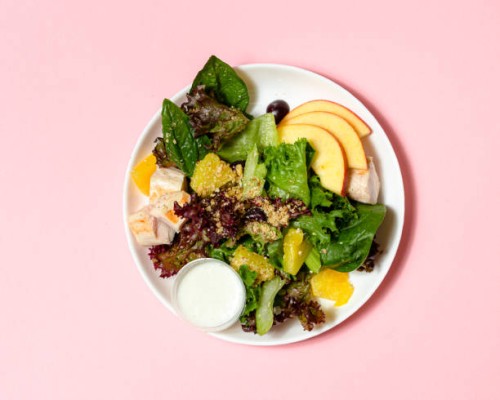 healthy salad with chicken, quinoa, spinach and orange. top view. copy space. - food stock pictures, royalty-free photos & images