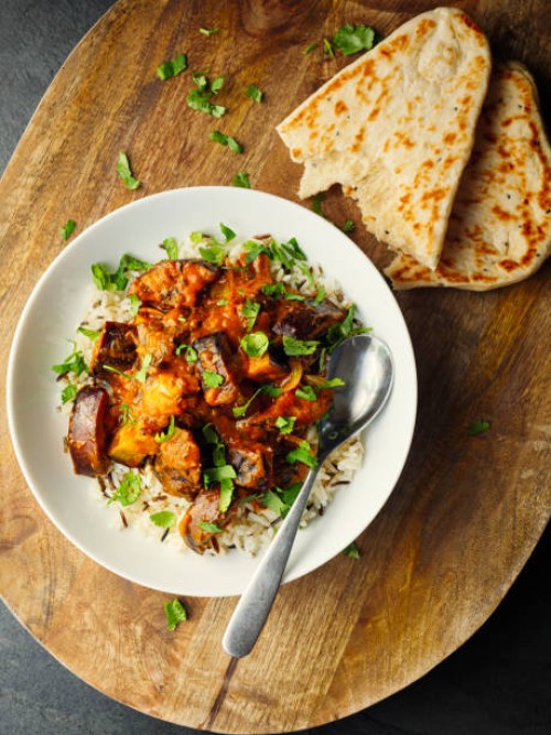 healthy vegan aubergine masala with long grain rice and naan bread - food stock pictures, royalty-free photos & images