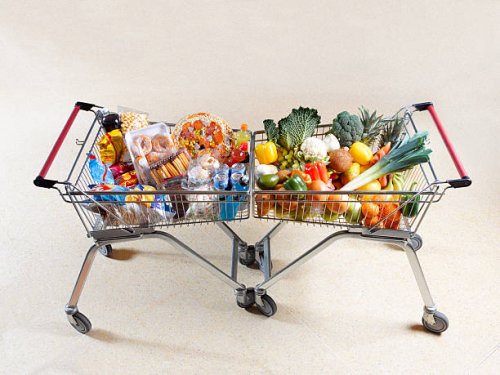healthy vs unhealthy shopping trolleys - junk food stock pictures, royalty-free photos & images