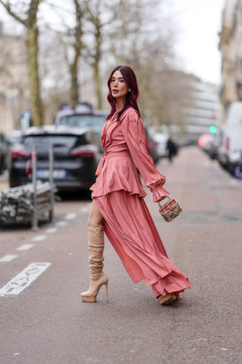 Heart Evangelista wears dark pink long sleeve wrapped Elie Saab maxi dress, dark pink embroidered dress, light brown knee high slouchy platform...