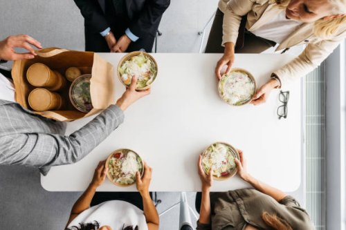 high-angle shot of takeaway lunch at work - junk food stock pictures, royalty-free photos & images