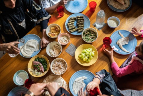 high angle view of a islamic family having lunch together at home - food stock pictures, royalty-free photos & images
