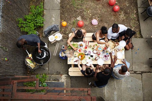 high angle view of friends enjoying backyard barbecue - garden decoration stock pictures, royalty-free photos & images