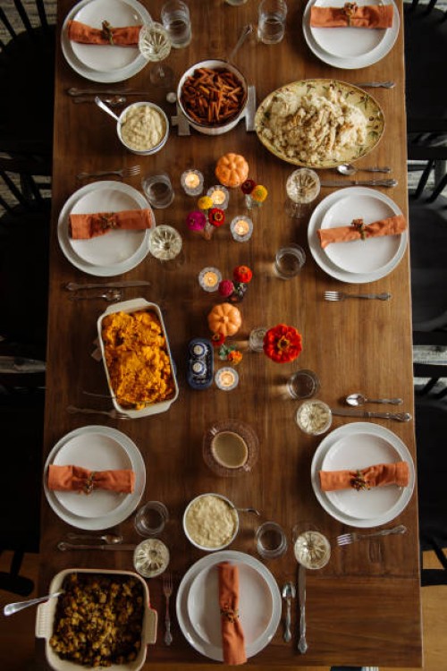 high angle view of thanksgiving dinner table - home decoration stockfoto's en -beelden