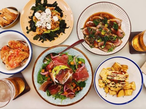 high angle view of various tapas dishes in a restaurant, barcelona, spain - food stock pictures, royalty-free photos & images