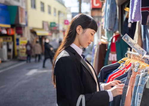 high school girl shopping on street after school - fashion stock pictures, royalty-free photos & images