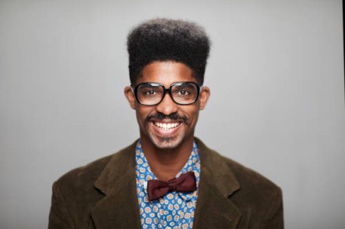 hispanic man headshot dressed as a nerd teacher. - hairstyle stock pictures, royalty-free photos & images