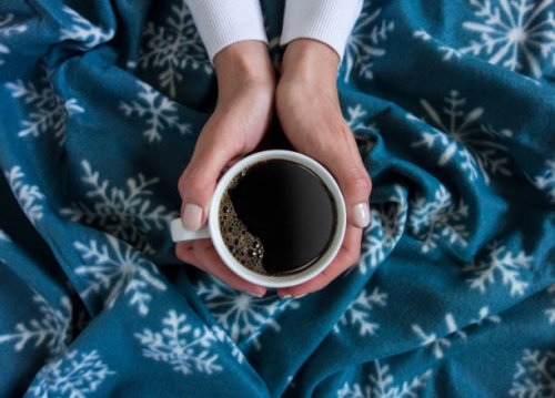 holding a cup of coffee - coffee stock pictures, royalty-free photos & images