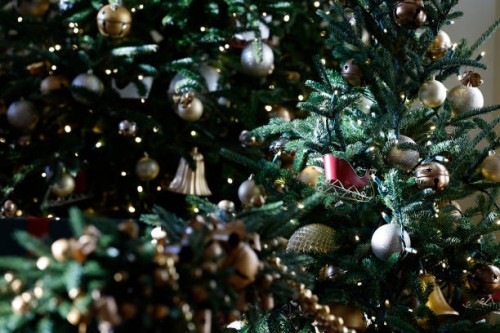 Holiday decorations are seen on a Christmas tree in the East Garden Room during a media preview of the 2024 holiday decorations at the White House on...