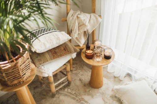 home decoration with burning candles on wooden coffee table in bright and cozy living room. - home decoration stock pictures, royalty-free photos & images