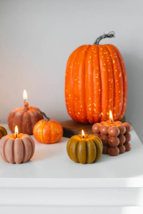 home interior decor. white dresser with burning candles. still life, autumn hygge concept. happy halloween holiday - home decoration stock pictures, royalty-free photos & images