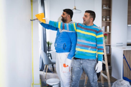 home painters working as a team - home decoration stockfoto's en -beelden