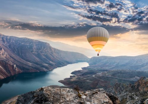 hot air balloons flying over the botan canyon in turkey - travel stock pictures, royalty-free photos & images