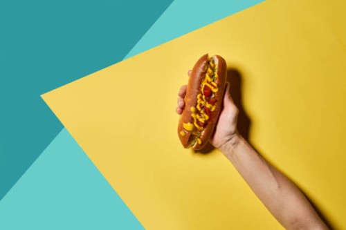 hotdog on a colorful background. - food stock pictures, royalty-free photos & images