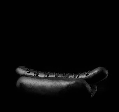 hotdog on black backdrop - junk food stock pictures, royalty-free photos & images