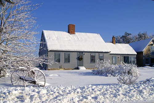 house covered in snow with two chimneys and many windows - garden decoration stock pictures, royalty-free photos & images