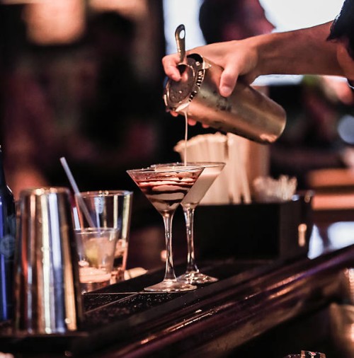 human hand making cocktails with bokeh background. - junk food stock pictures, royalty-free photos & images