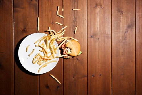 humburger and frensh fries on floor - food stock pictures, royalty-free photos & images