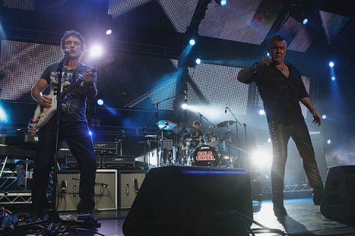 Ian Moss and Jimmy Barnes of Cold Chisel perform during a Cold Chisel concert at ANZ Stadium on December 5, 2009 in Sydney, Australia.