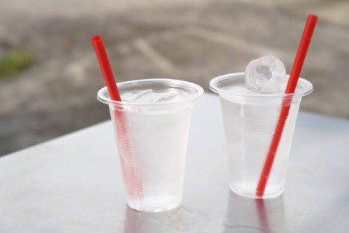 ice water in plastic cup - junk food stock pictures, royalty-free photos & images