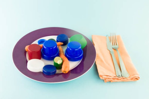 if we don't keep the sea free of plastic, we'll end up eating it - junk food stockfoto's en -beelden