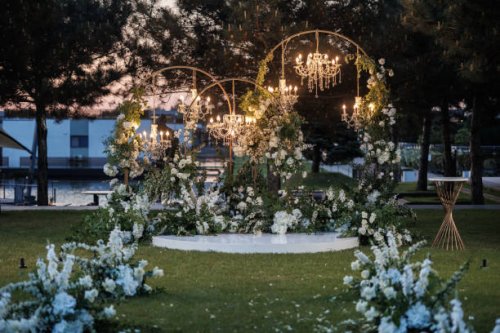 illuminated outdoor wedding reception under the green pines - garden decoration stock pictures, royalty-free photos & images