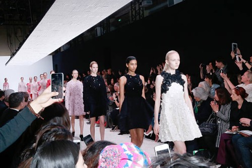 Illustrationn View of People taking pictures and movies with their smartphone whyle the Giambattista Valli show as part of the Paris Fashion Week...