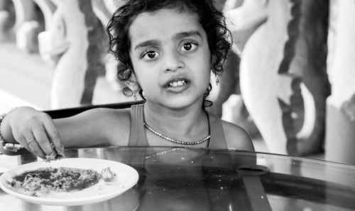 indian baby girl in restaurant - junk food stock pictures, royalty-free photos & images